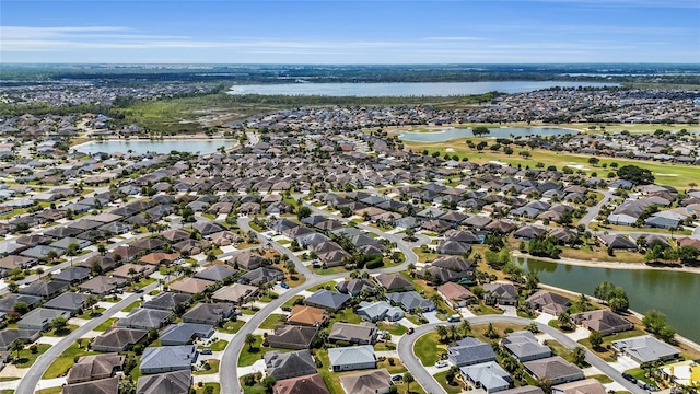 aerial view featuring a residential view and a water view