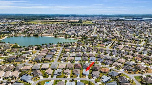 birds eye view of property featuring a residential view and a water view