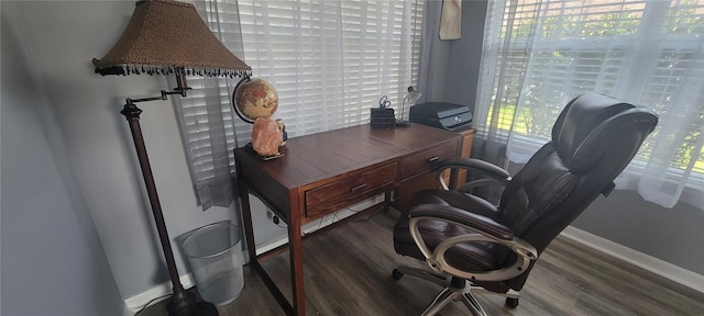 home office featuring baseboards and wood finished floors