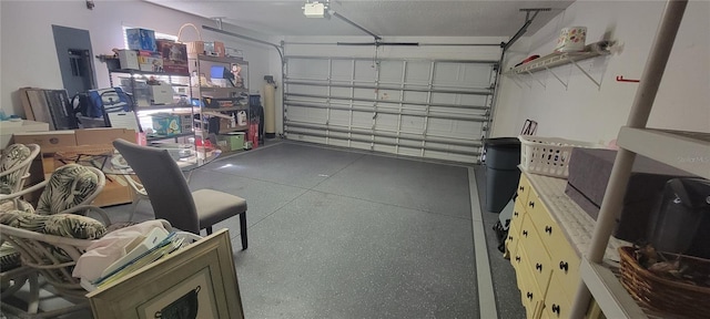 garage featuring electric panel and a garage door opener