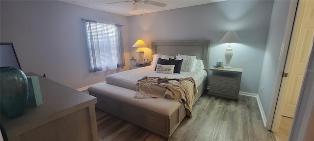 bedroom featuring baseboards, light wood-type flooring, and ceiling fan