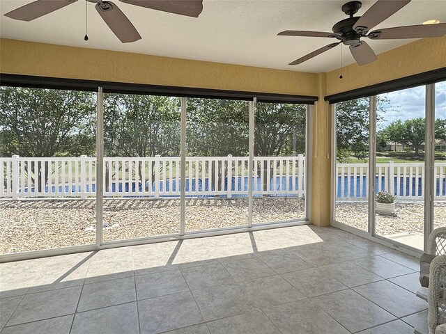 3325 Archer Ave, The Villages, FL 32162 - unfurnished sunroom with ceiling fan