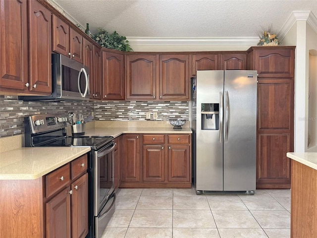 3325 Archer Ave, The Villages, FL 32162 - kitchen featuring appliances with stainless steel finishes, a textured ceiling, crown molding, light countertops, and tasteful backsplash