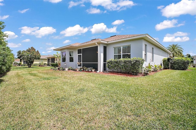 10021 Lake Miona Way, Oxford, FL 34484 - rear view of property with a yard and stucco siding