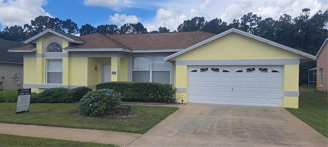 2855 Picadilly Cir, Kissimmee, FL 34747 - ranch-style house featuring stucco siding, concrete driveway, a front yard, an attached garage, and roof with shingles