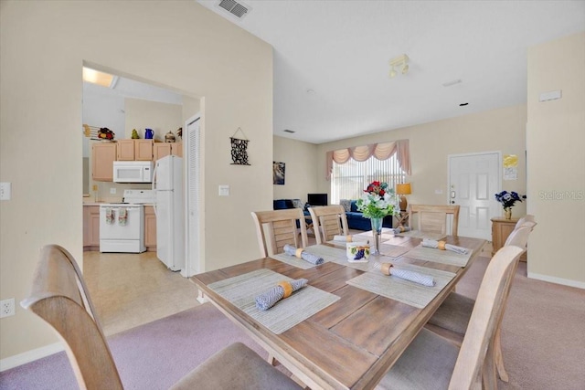 2855 Picadilly Cir, Kissimmee, FL 34747 - dining room featuring baseboards and light colored carpet