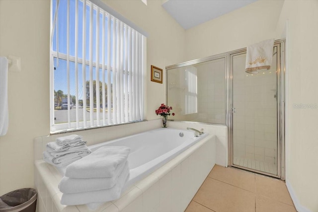 2855 Picadilly Cir, Kissimmee, FL 34747 - bathroom featuring a shower stall, a bath, and tile patterned floors