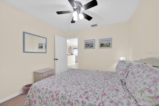 2855 Picadilly Cir, Kissimmee, FL 34747 - bedroom featuring carpet flooring, ceiling fan, and a textured ceiling