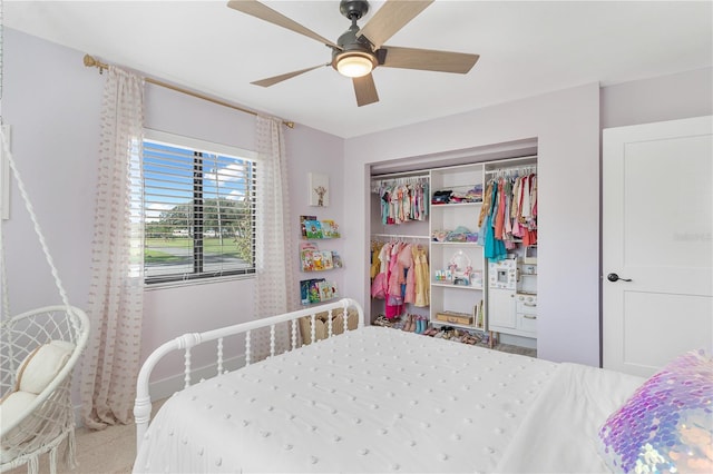 carpeted bedroom with a closet and ceiling fan