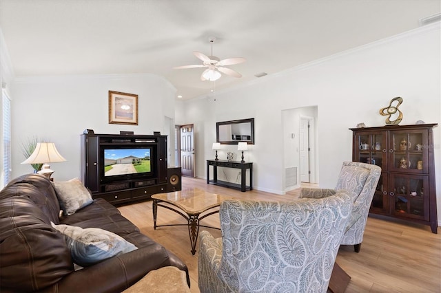 living room featuring light wood-type flooring, visible vents, ceiling fan, and crown molding