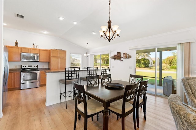 dining area featuring vaulted ceiling, visible vents, an inviting chandelier, and ornamental molding