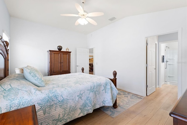 bedroom with a ceiling fan, light wood finished floors, baseboards, lofted ceiling, and visible vents