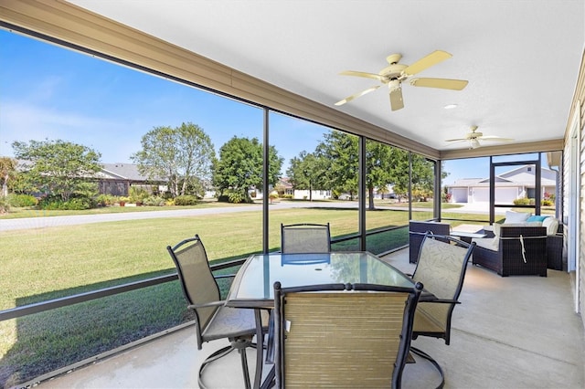 sunroom / solarium with outdoor lounge area, a ceiling fan, and outdoor dining space