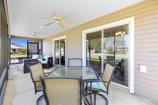 sunroom featuring an outdoor hangout area, outdoor dining space, and ceiling fan