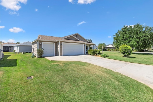 ranch-style house with concrete driveway, a garage, and a front yard