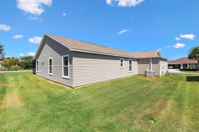 rear view of house with a yard