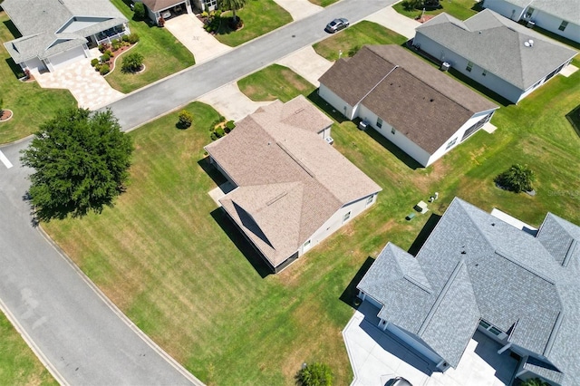 birds eye view of property with a residential view