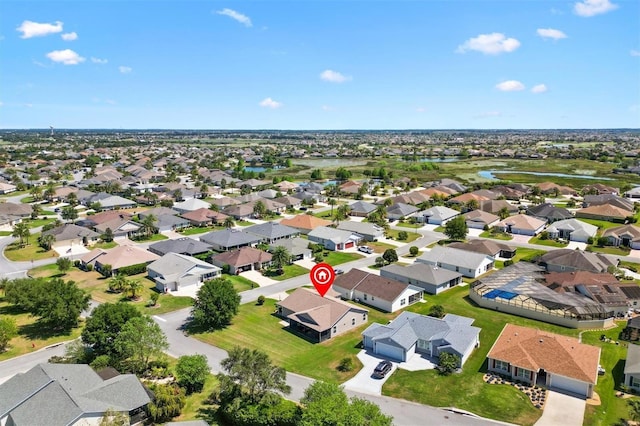drone / aerial view with a residential view and a water view