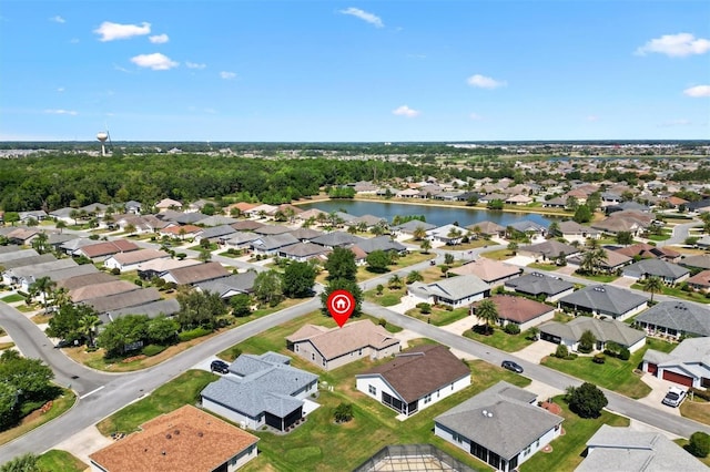 bird's eye view featuring a residential view and a water view