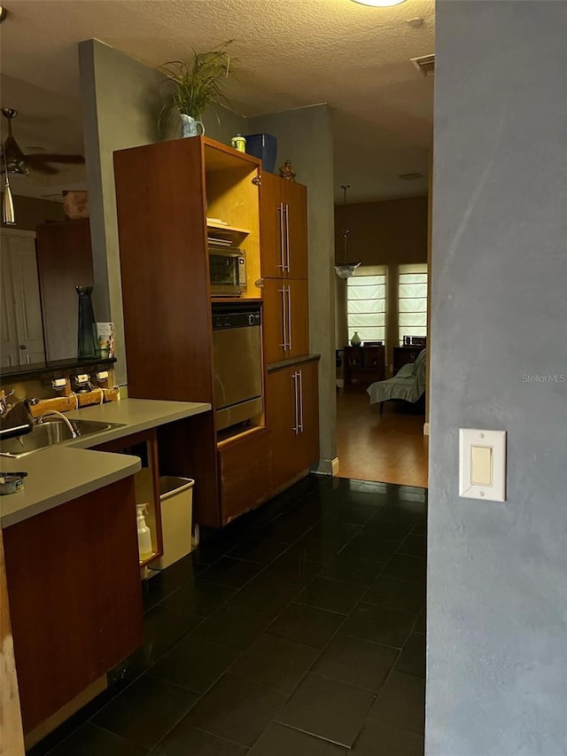 kitchen featuring visible vents, open shelves, a sink, ceiling fan, and light countertops