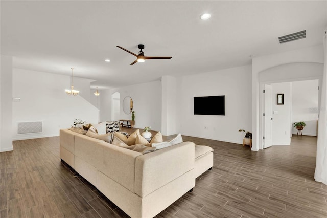 living room featuring visible vents, recessed lighting, and dark wood finished floors