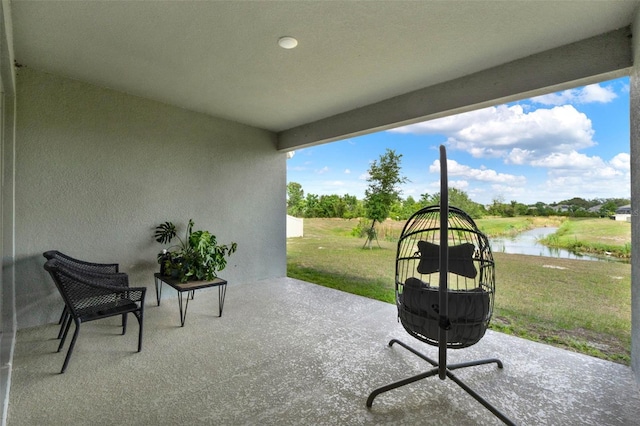 view of patio featuring a water view