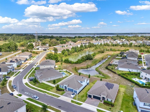 birds eye view of property featuring a water view and a residential view