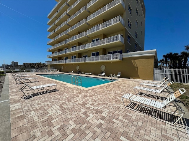 1705 S Atlantic Ave Unit 502, New Smyrna Beach, FL 32169 - pool with a patio area and fence