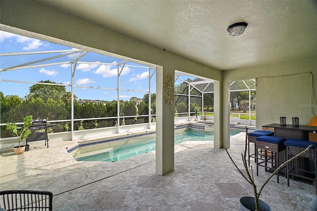54 Andora Ct, Kissimmee, FL 34758 - view of pool with a patio area, a pool with connected hot tub, outdoor dry bar, and a lanai
