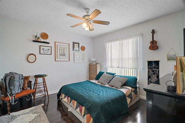 54 Andora Ct, Kissimmee, FL 34758 - bedroom featuring a textured ceiling, dark wood-style flooring, baseboards, and a ceiling fan