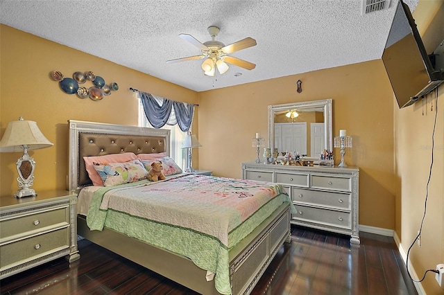 54 Andora Ct, Kissimmee, FL 34758 - bedroom with dark wood-type flooring, visible vents, baseboards, and a textured ceiling