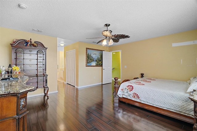 54 Andora Ct, Kissimmee, FL 34758 - bedroom featuring dark wood-style flooring, baseboards, a textured ceiling, visible vents, and ceiling fan