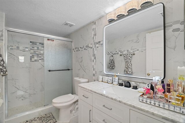 54 Andora Ct, Kissimmee, FL 34758 - bathroom featuring a textured ceiling, toilet, a shower stall, visible vents, and tile walls