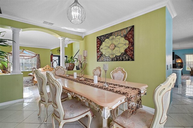 54 Andora Ct, Kissimmee, FL 34758 - dining room featuring light tile patterned flooring, decorative columns, baseboards, and visible vents