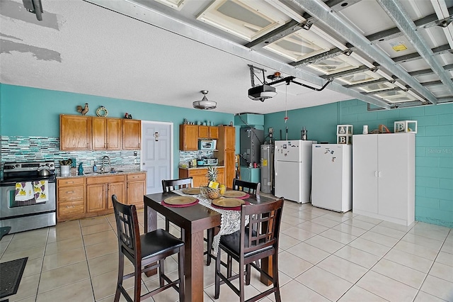 54 Andora Ct, Kissimmee, FL 34758 - dining area with electric water heater and light tile patterned floors