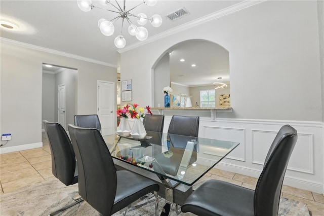 dining room with arched walkways, an inviting chandelier, crown molding, and visible vents