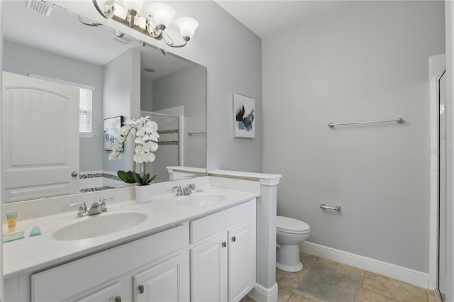 bathroom with visible vents, baseboards, a sink, and a stall shower