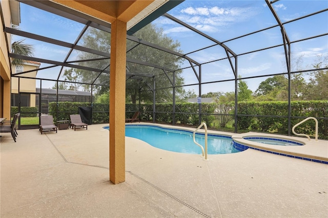 view of swimming pool with a lanai, a patio, and a pool with connected hot tub