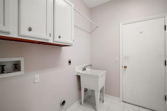 laundry room featuring electric dryer hookup, baseboards, washer hookup, cabinet space, and marble finish floor