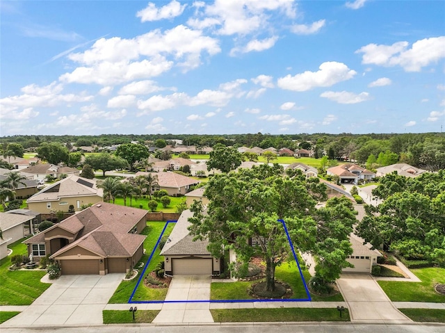 birds eye view of property with a residential view