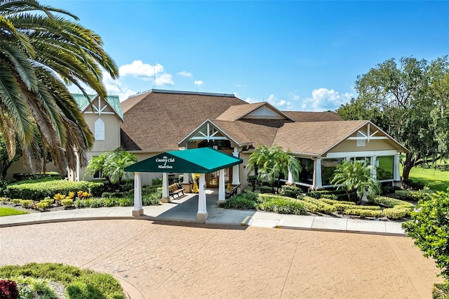 view of property's community with curved driveway