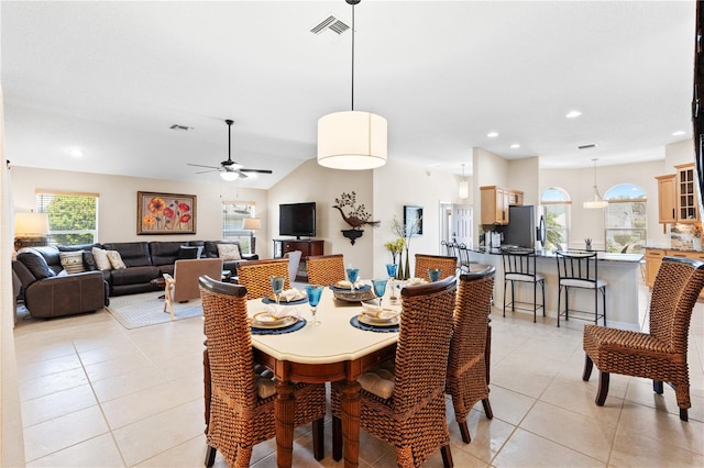 dining room featuring visible vents, light tile patterned floors, and a healthy amount of sunlight