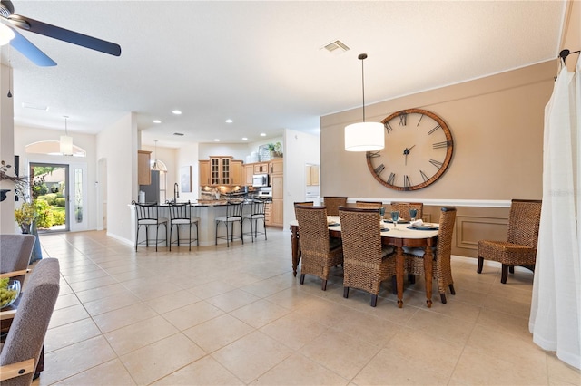 dining space featuring recessed lighting, light tile patterned flooring, visible vents, ceiling fan, and arched walkways