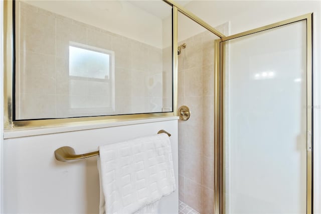 full bath with a tile shower