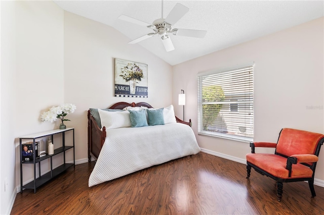 bedroom featuring baseboards, a ceiling fan, wood finished floors, and lofted ceiling