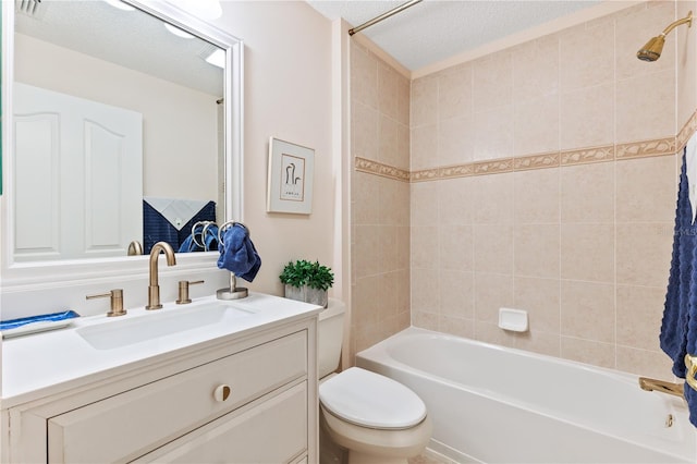 bathroom with toilet, shower / bathing tub combination, vanity, and a textured ceiling