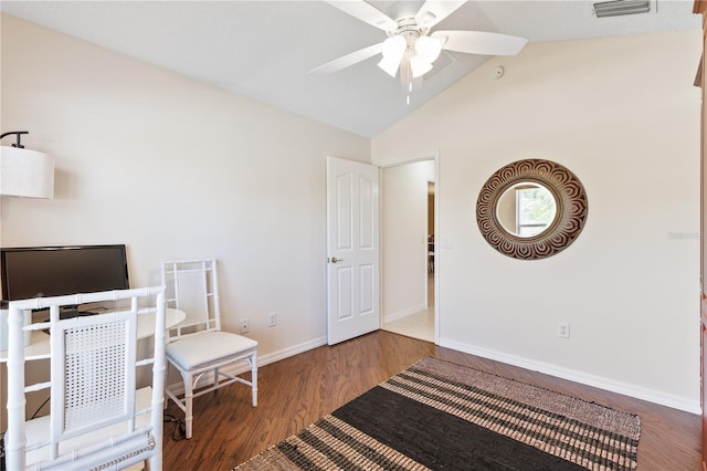 interior space featuring ceiling fan, vaulted ceiling, visible vents, wood finished floors, and baseboards