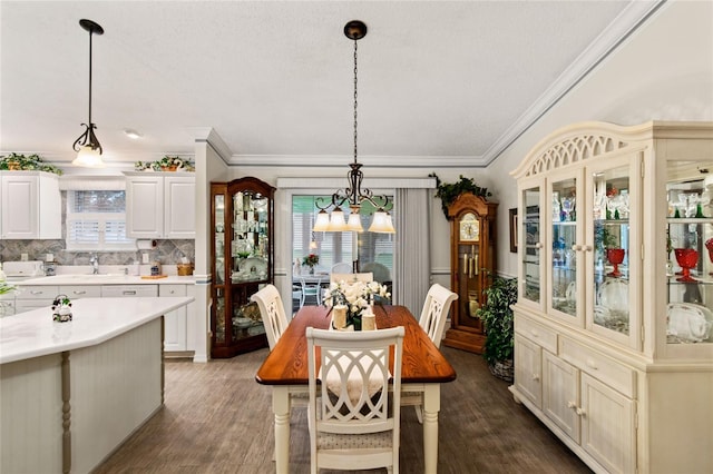 1526 Blueberry Way, The Villages, FL 32162 - dining area with dark wood-type flooring, a notable chandelier, and ornamental molding