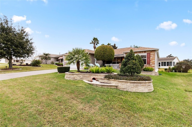 1526 Blueberry Way, The Villages, FL 32162 - ranch-style home with concrete driveway, a front lawn, and covered porch