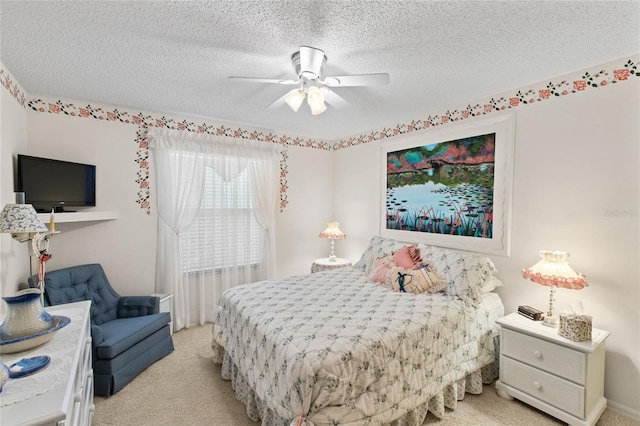 1526 Blueberry Way, The Villages, FL 32162 - bedroom with light colored carpet, a textured ceiling, and ceiling fan